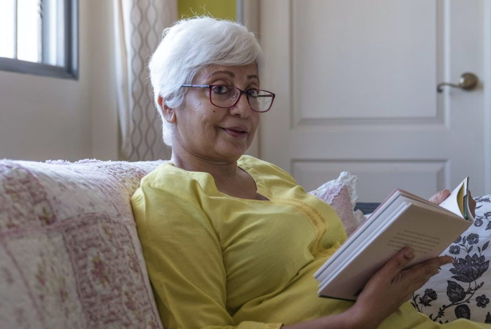 A Woman Sitting On A Couch