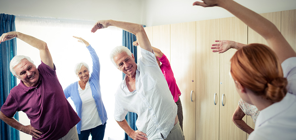 Seniors stretching in an exercise class