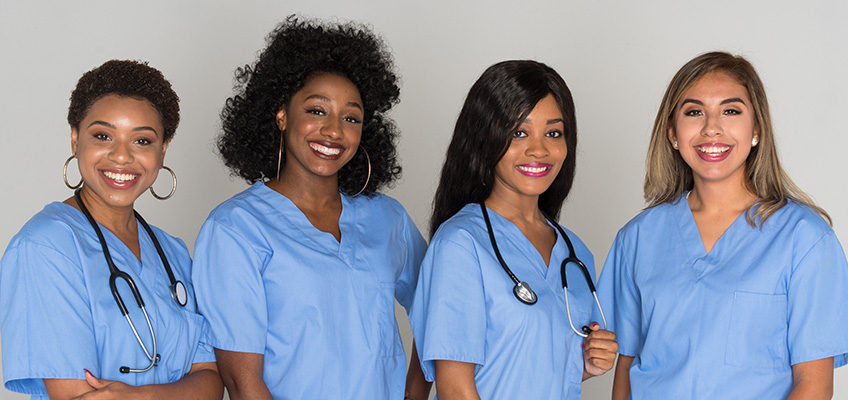 Four smiling nurses